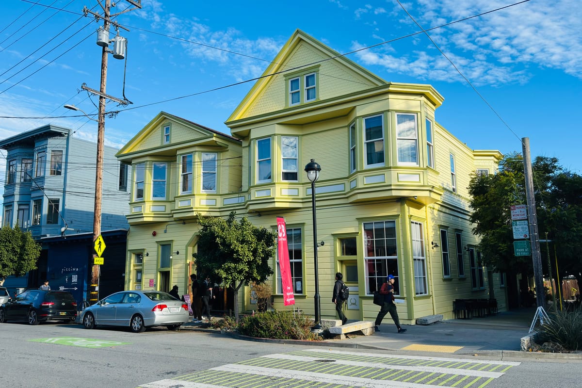 A restored corner Victorian in San Francisco's Dogpatch, with the neighborhood's mix of period houses and newer construction behind.